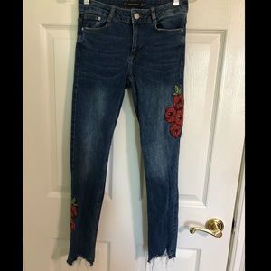 full length blue jeans with red rose embroidery